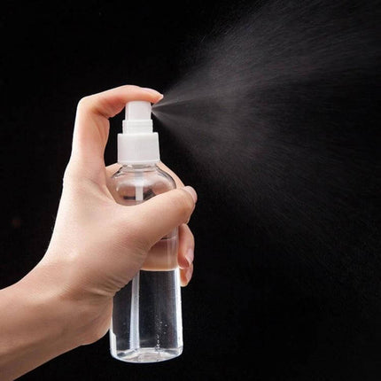 100ml PET Clear Spray Bottle For Disinfectants Daily Household Use in hand spraying a fine mist for cleaning and sanitizing