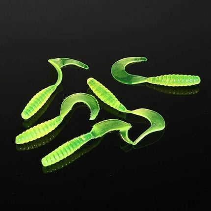 101 Piece Fishing Lure Kit With Plastic Box For Everyday Fishing - close-up of bright green soft plastic grub lures on black background