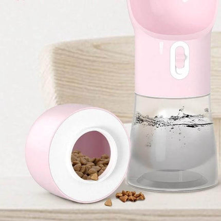 Portable Dog Water Bottle With Food Compartment For Travel in pink showing top water cup and detachable food container