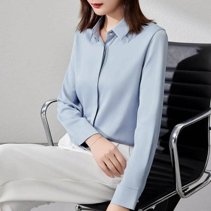Elegant Satin Long Sleeve Top for Women's Office Wear - light blue satin shirt-sleeve blouse with stitch button detail, styled with white trousers for professional look