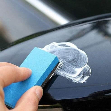 Car Scratch Remover Paste for Minor Auto Paint Repairs applied with sponge to buff out light key scratches on black car paint