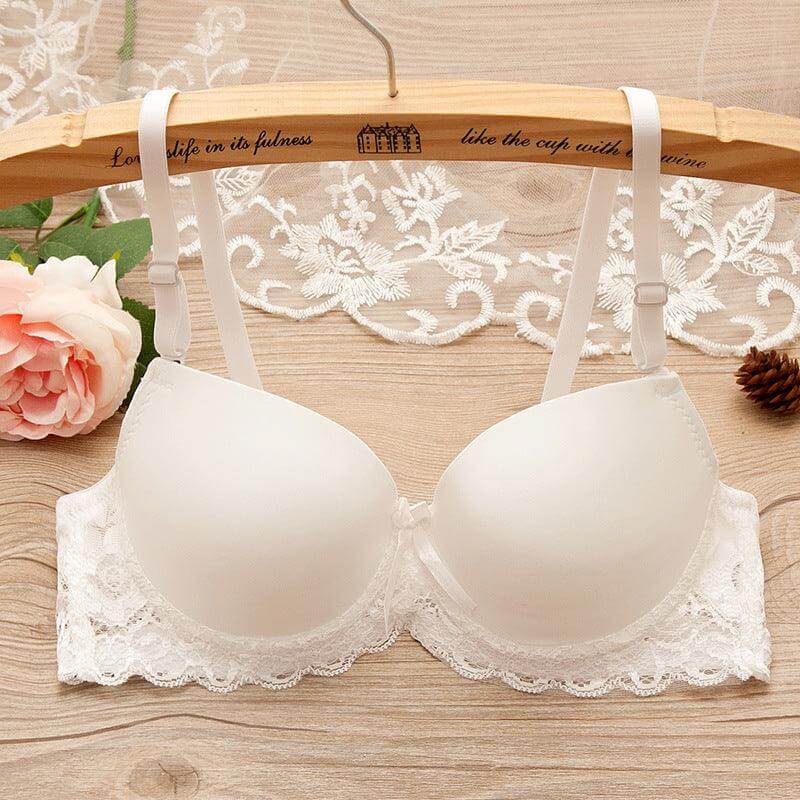 Underwire gathered bra for small bust with lace and bow details on a wooden hanger, featuring thin mold cups for a sleek silhouette