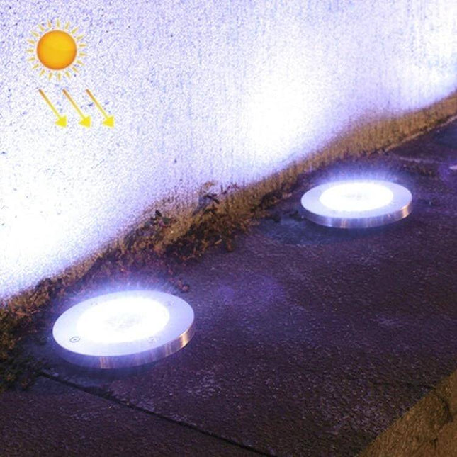 2-Pack Outdoor Solar Garden Lights, 20 LEDs, Waterproof Lawn Buried Lights installed along a pathway with bright white glow at night