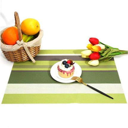 2-Pack PVC Stripe Placemats For Everyday Dining 45 X 30 Cm green striped PVC placemat on table with fruit, dessert and tulips