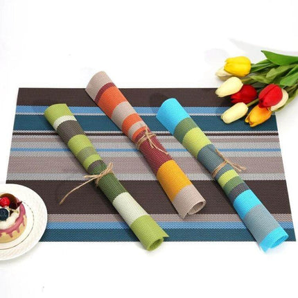 2-Pack PVC Stripe Placemats For Everyday Dining 45 X 30 Cm - striped PVC placemats rolled and flat on table with tulips and dessert
