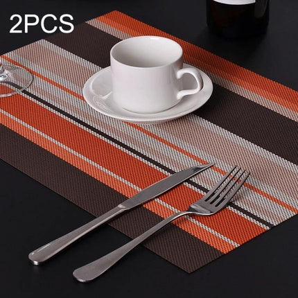2-Pack PVC Stripe Placemats For Everyday Dining 45 X 30 Cm orange brown striped PVC placemat with cup and cutlery on black table