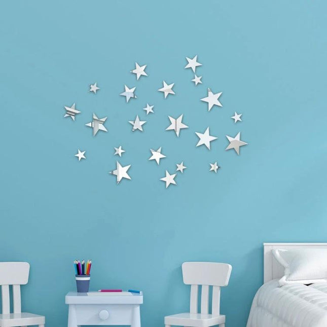 20-Piece Acrylic Stars Mirror Wall Stickers For Home Decor displayed as reflective star cluster on blue nursery wall above bed and chairs