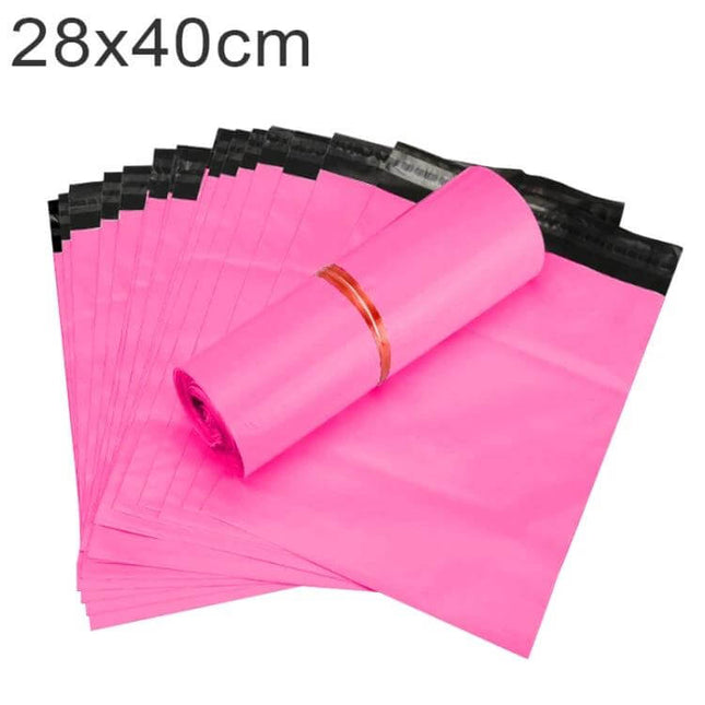 28x40cm Waterproof Packaging Bags, 100 Pcs Per Roll - pink waterproof mailer bags on a roll with secure one-way seal and reinforced edge banding