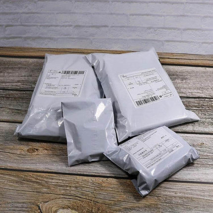28x40cm Waterproof Packaging Bags, 100 Pcs Per Roll - white waterproof mailer bags on roll with secure one-way seal and edge banding, 28×40cm size