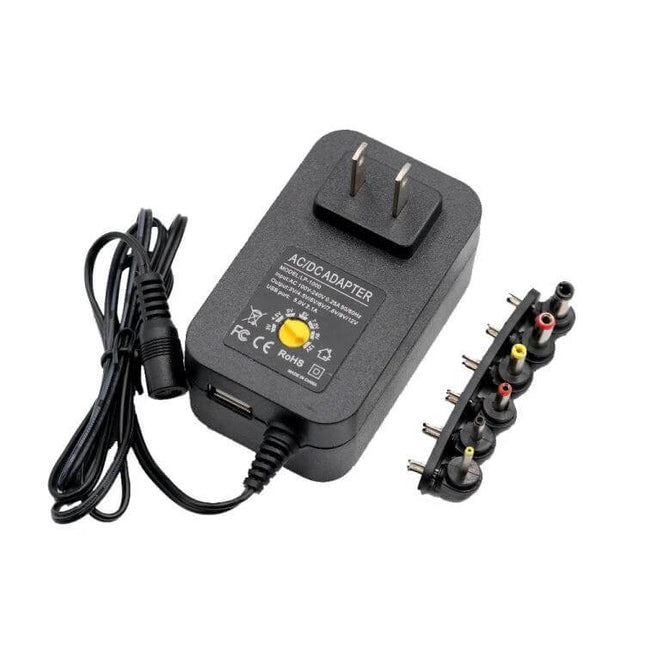 3-12V Adjustable Voltage Power Supply With EU and US Plug - compact 12W DC adapter with US plug, adjustable 3–12V output and multiple connector tips