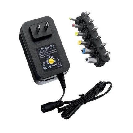 3-12V Adjustable Voltage Power Supply With EU and US Plug compact 12W DC adapter with multiple connector tips, US plug shown, for electronics projects