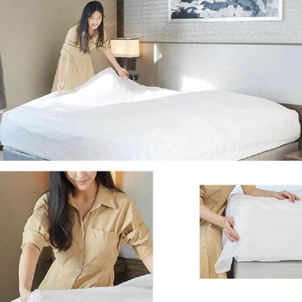 3-In-1 Travel Hotel Disposable Bedding Set For One Person shown on hotel bed being placed by woman, pre-sterilized vacuum-packed single-use set