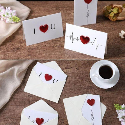 3D Heart Valentine Day Greeting Card With Envelopes showing red heart pop-up cards with envelopes on wooden table