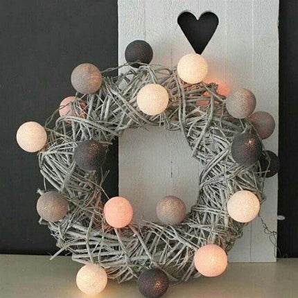 3M Cotton Ball String Lights For Holiday Decor 20 LEDs draped on grey wreath creating warm cozy mantel decor