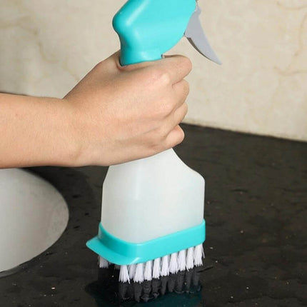 4 In 1 Double Sided Glass Wiper Window Squeegee With Spray Bottle held over sink showing spray bottle, brush and squeegee heads for cleaning glass and tiles