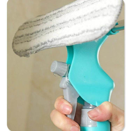 4 In 1 Double Sided Glass Wiper Window Squeegee With Spray Bottle held close-up showing microfiber pad and spray trigger for bathroom mirror and window cleaning