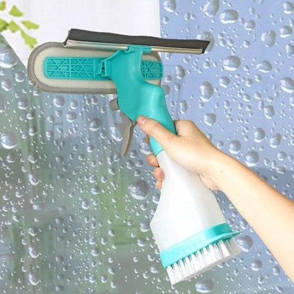 4 In 1 Double Sided Glass Wiper Window Squeegee With Spray Bottle held to clean a wet glass window, showing squeegee, brush and 250ml spray bottle