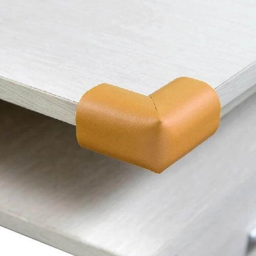 4-Pack Baby Safe Corner Guard Cushion To Protect Table Edges on white table corner, tan NBR foam 12mm, fire retardant non-toxic double-stick tape