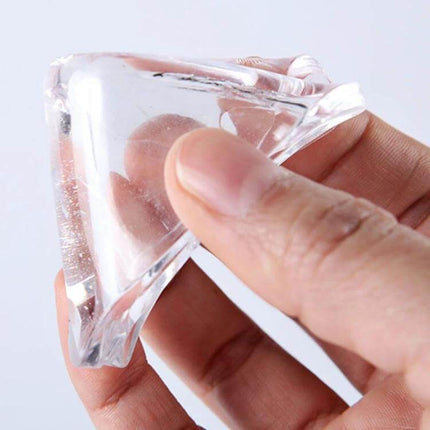 4 Pack Transparent Washing Machine Silicone Pads For Vibration Reduction - close-up of hand holding transparent silicone anti-vibration pad with adhesive backing