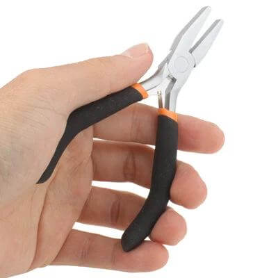 4.5 Inch Flat Nose Pliers For Jewelry Making And Crafting held in hand showing flat-nose jaws and black ergonomic handles for precise bending