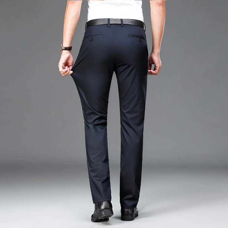 Back view of man wearing Bamboo Fiber Lightweight Casual Business Trousers in navy blue, highlighting comfort and flexible fit.