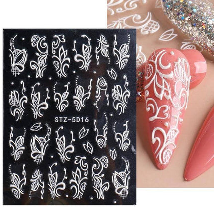 5D Rose Pattern Embossed Nail Art Stickers For Easy Manicure - white embossed floral nail decals on black sheet with applied 3D rose textured manicure