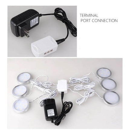 6-Port LED Hub Splitter for Cabinet Lights With DC Head connected to power adapter and six under-cabinet LED puck lights, compact wiring setup