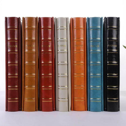 6-Inch PU Leather Photo Album With Bronzing Cover - assortment of vertical PU leather albums in multiple colors with gold-embossed spine, holds 4R photos