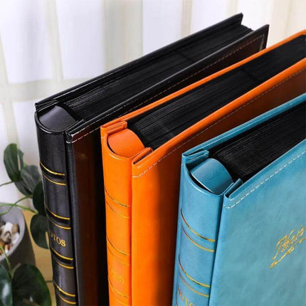 6-Inch PU Leather Photo Album With Bronzing Cover showing black, orange, and teal albums with bamboo-stamped bronzing finish, fits 4R prints up to 500 photos