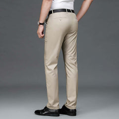 Man wearing Bamboo Fiber Lightweight Casual Business Trousers in beige with black shoes and a white shirt.