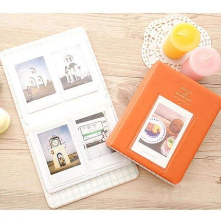 64-Pocket Instax Mini Photo Album For Your Memories compact orange cover holding Instax Mini prints, 64 pockets plus front display