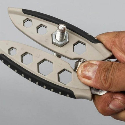 7-Inch Multipurpose Wire Stripper With Hex Hole Set held showing hex wrench holes and spring-loaded grip