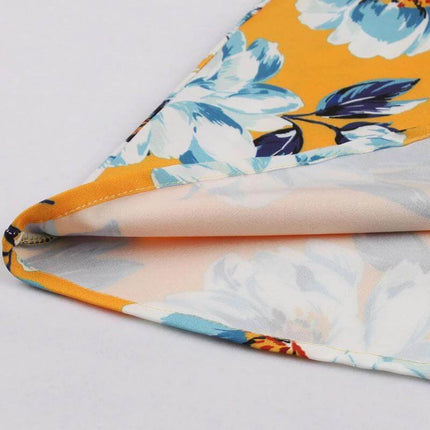 Women's Floral Dress for Casual Everyday Outings close-up of yellow floral fabric hem and polyester-spandex blend detail