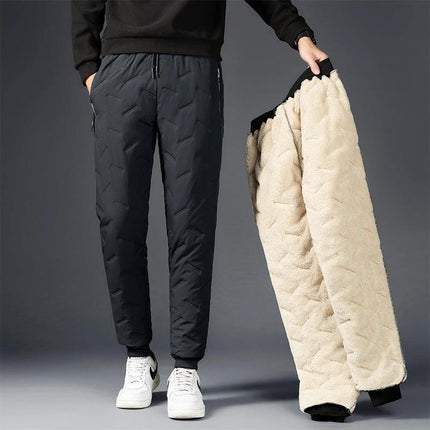 Men's Comfortable Padded Cotton Blend Trousers for Daily Use model wearing black padded trousers holding fleece jacket