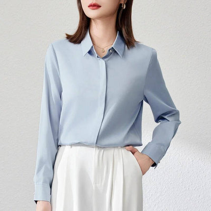 Elegant Satin Long Sleeve Top for Women's Office Wear in light blue satin, long sleeves, shirt cuff, stitch button detail, paired with white skirt