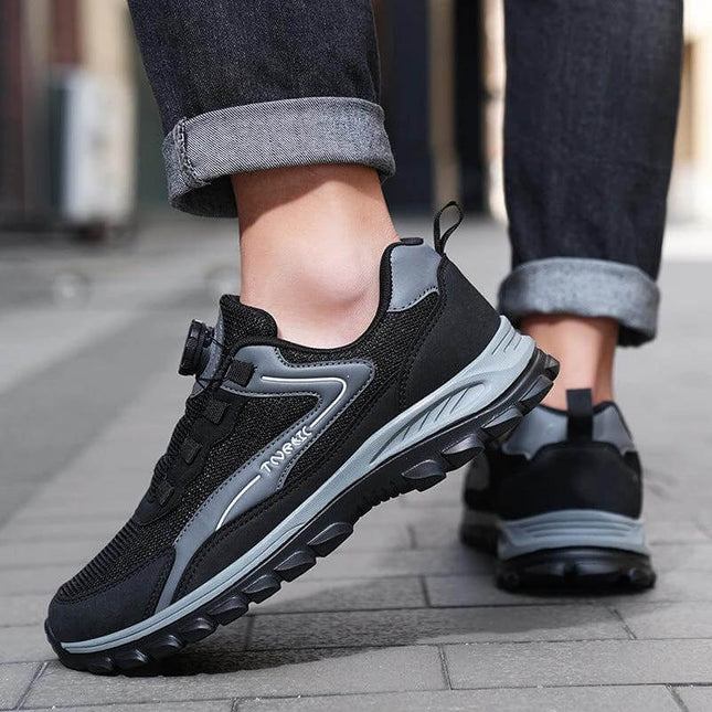 Unisex Low Top Sneakers With Thick Rubber Sole For Running black grey low-top sneaker on city pavement showing cushioned sole and slip-resistant tread