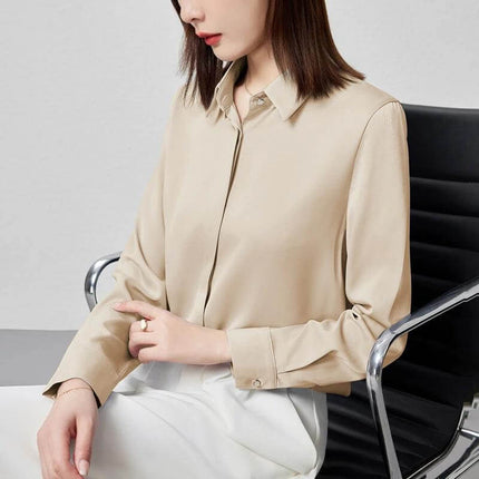 Elegant Satin Long Sleeve Top for Women's Office Wear in apricot satin, long sleeves, stitch button detail, paired with white pants