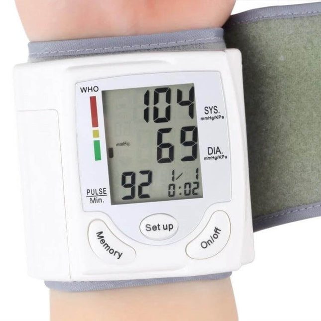 Automatic Wrist Blood Pressure Monitor For Home Use on wrist showing clear digital systolic 104 diastolic 69 pulse 92 display