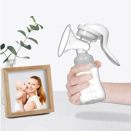 Adjustable 2 In 1 Manual Breast Pump And Feeding Bottle held in hand showing compact syringe-style manual pump and attached feeding bottle