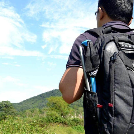 Adjustable Outdoor Trekking Poles for Hiking, Aluminum, 107-125 cm carried in backpack on hiker in nature