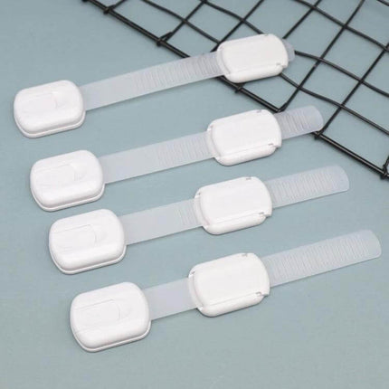 Adjustable Slide Baby Safety Lock for Cabinets and Drawers shown as four white adjustable slide locks on a table, ideal for securing cabinets and drawers