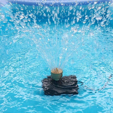 All-Copper Water Nozzle For Landscaping Fountain 1.5 Inch producing firework-style spray from a compact lotus-shower nozzle in a mid-sized decorative fountain