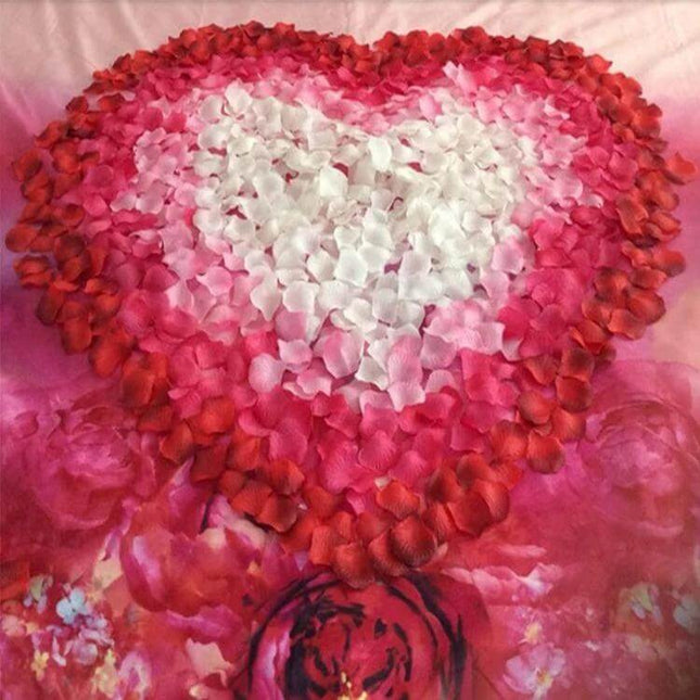 Artificial Wedding Rose Petals Assorted Colors For Wedding Decor heart-shaped ombre rose petal arrangement on pink fabric table
