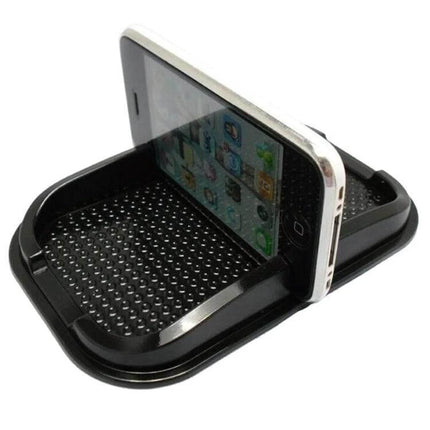 Punctate Black Car Phone Slip Mat for Secure Vehicle Use on dashboard holding phone upright with punctate grip surface
