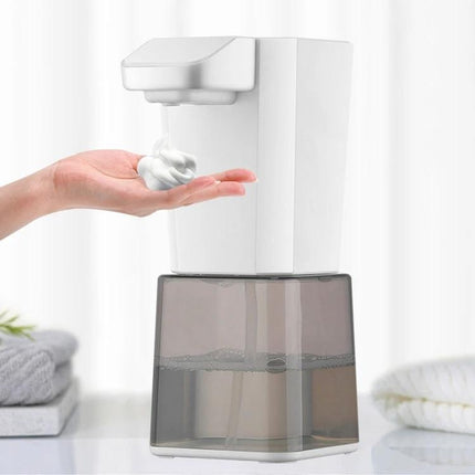 Automatic Foam Soap Dispenser for Home Hand Washing dispensing foam onto a hand, white touchless pump with clear reservoir on bathroom counter