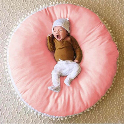 Baby Bean Bag Chair Portable Foldable For Feeding And Naps - newborn yawning on pink round portable foldable baby sofa for feeding and naps