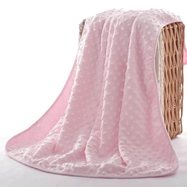 Baby Double Layer Knitted Fleece Blanket For Cozy Snuggles pink dotted plush baby blanket draped over wicker basket
