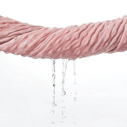 Baby Double Layer Knitted Fleece Blanket For Cozy Snuggles light pink double-layer fleece showing absorbent texture with water dripping