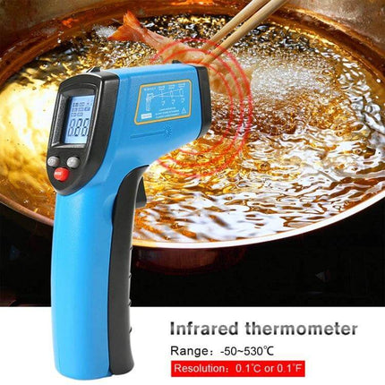 Benetech Handheld Infrared Thermometer for Cooking measuring hot oil in a skillet with laser aiming and LCD readout
