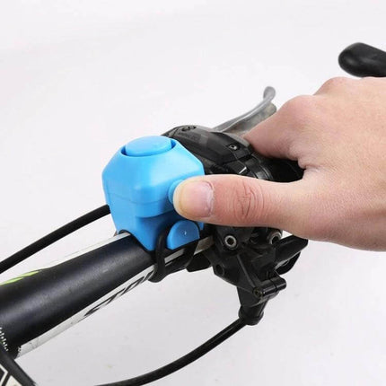 Bicycle Electric Horn With Bell Red Easy To Install No Battery mounted on handlebars — compact red battery-free horn with bell for commuting